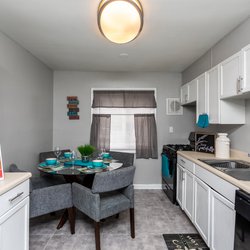 beautiful kitchen with family dining table at The Preserve on Conley located in Forest Park, GA